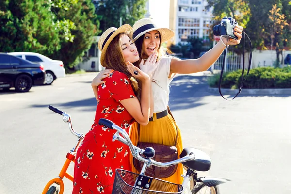 Two pretty girls taking selfie