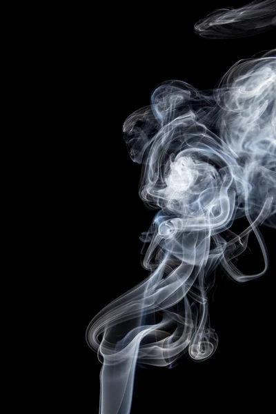 Abstract of smoke dance on a black background.