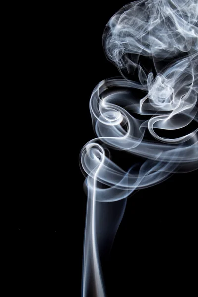 Abstract of smoke dance on a black background.