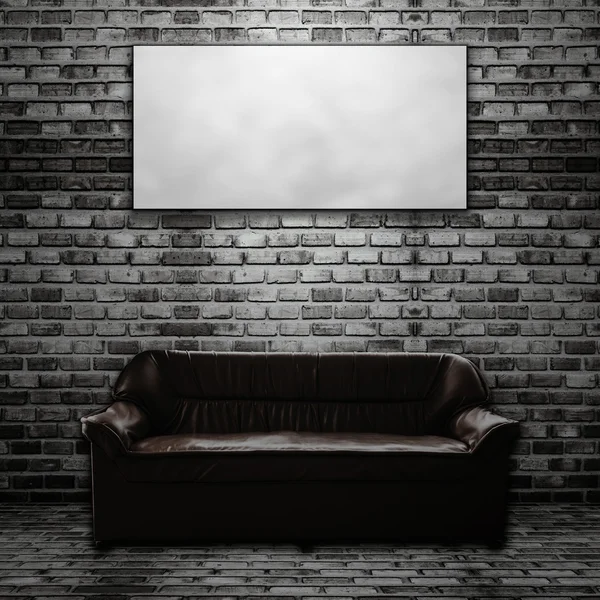Leather sofa in brick room and Blank folded paper poster hanging