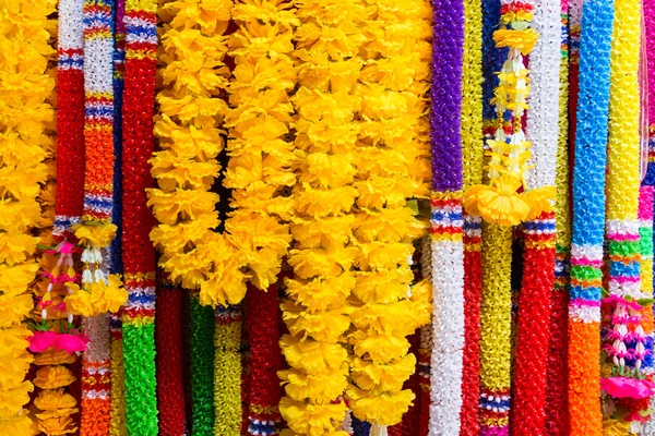 Colorful plastic garlands for worship