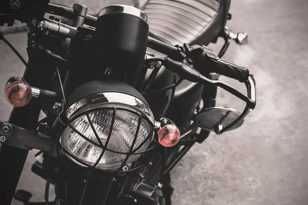 Selective focus point on vintage headlight lamp motorcycle