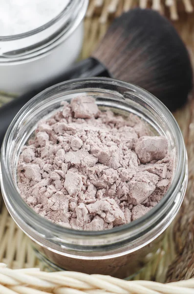 Homemade dry shampoo in a glass jar, close up