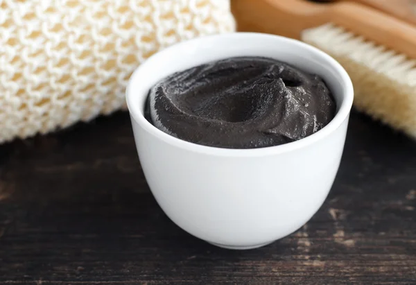 Black volcanic cosmetic clay in a bowl