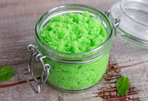 Green scrub in a glass jar
