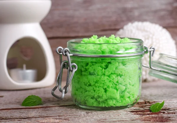 Green scrub in a glass jar