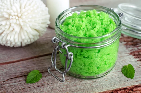 Green scrub in a glass jar