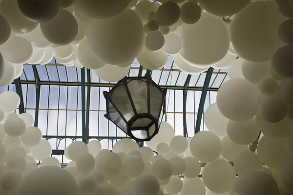Close up of Heartbeat white balloons installation by Charles Petillon in Covent Market