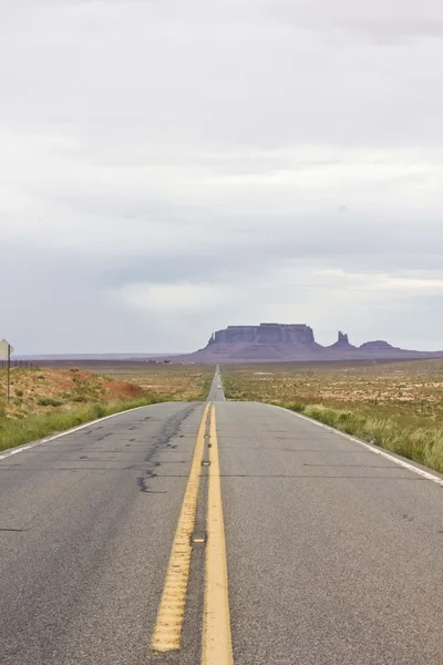 The scenic road to Monument Valley in a dull and foggy day
