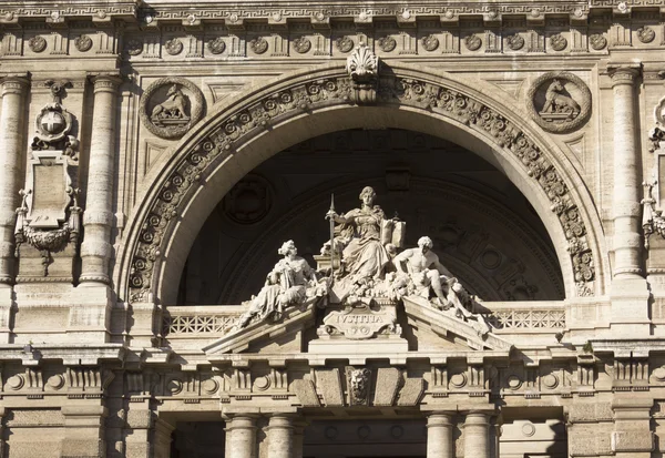 Close up of the statues on the doorway of Italian Corte di Cassazione