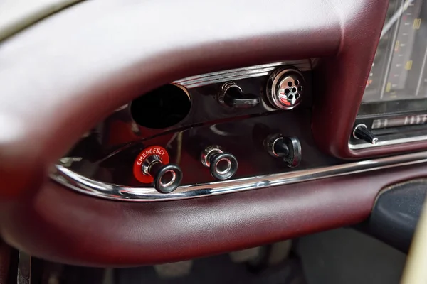 The buttons and levers on the dashboard vintage car.