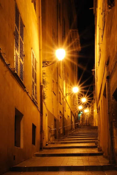 Night alley with steps of light rays in Nice, France