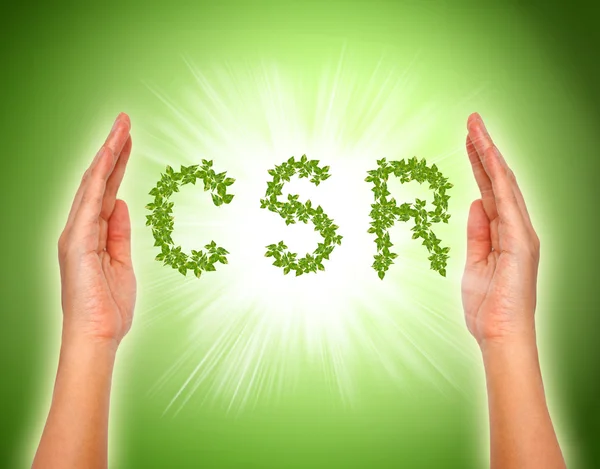 Leaf arranged in csr shape with supporting hands - corporate soc