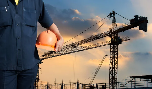 Engineer holding orange helmet for workers security