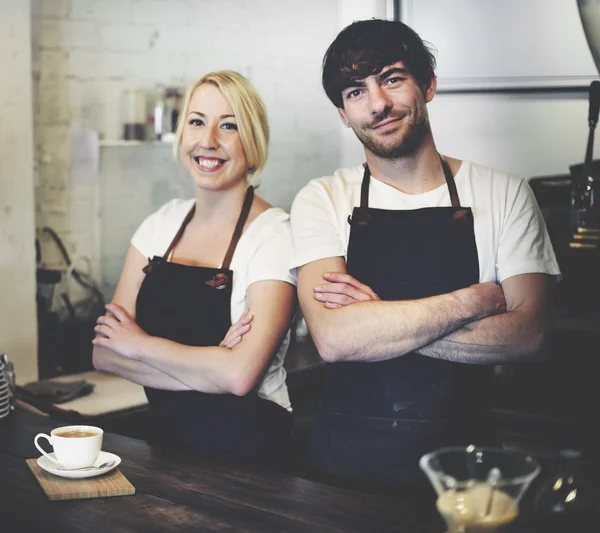 Woman and Man in Barista Cafe