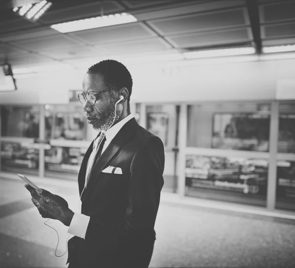 Businessman listens music