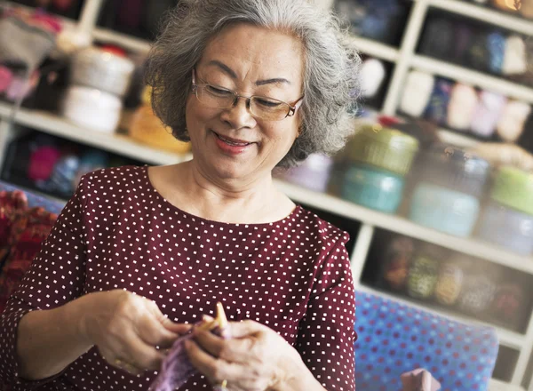 Senior woman and knitting hobby Concept