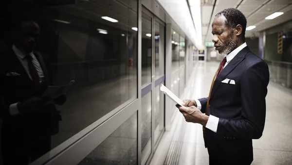 Businessman on platform on station