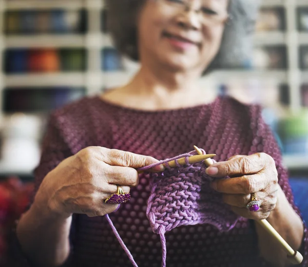 Senior woman and knitting hobby Concept