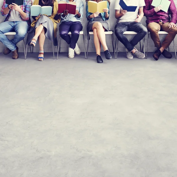 Diversity people sitting with books