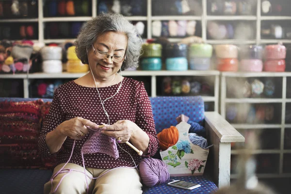 Elderly woman crocheting