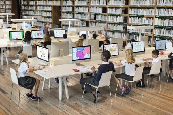 Children learning in computer classroom