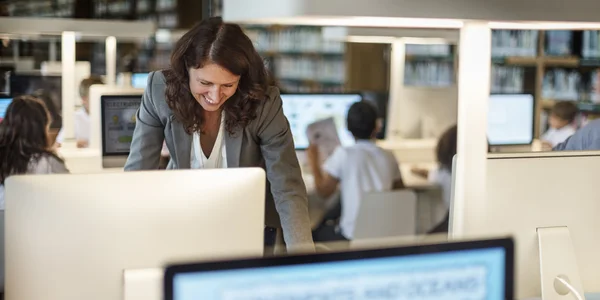 Teacher Preparing lesson in computer Classroom