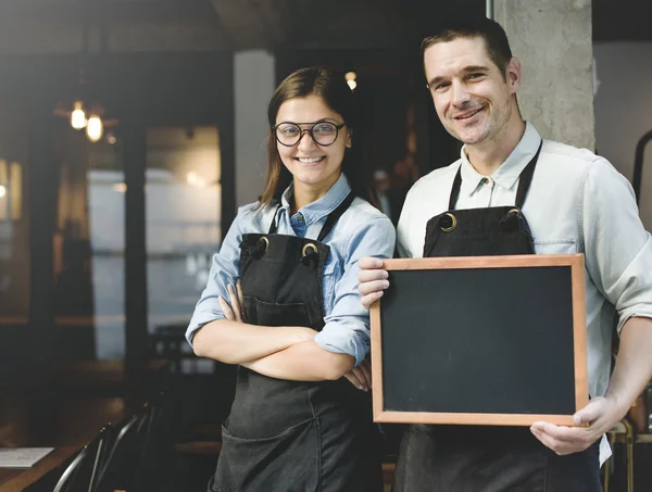 Colegues with black board