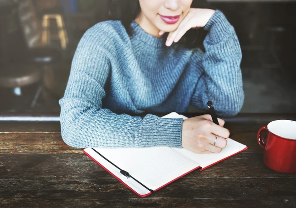 Asian  woman with notebook