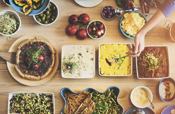 Friends eating for big table