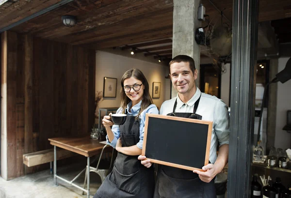 Colegues with black board