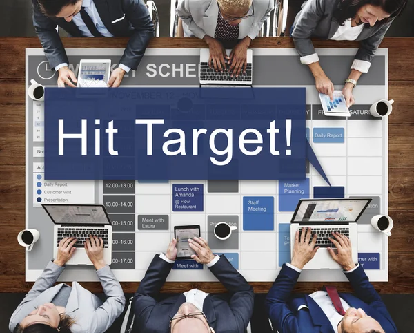 Business people and hit target