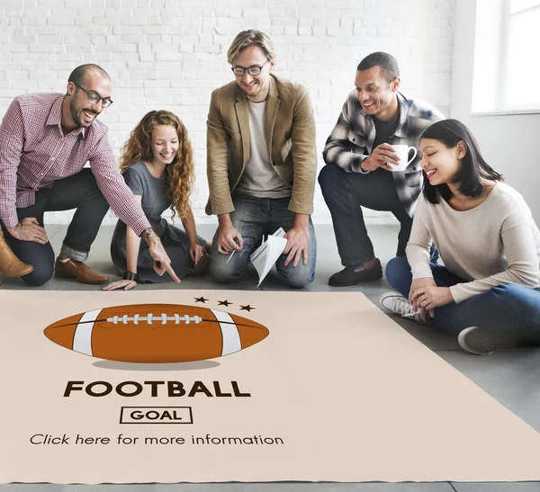 Designers working with poster and football