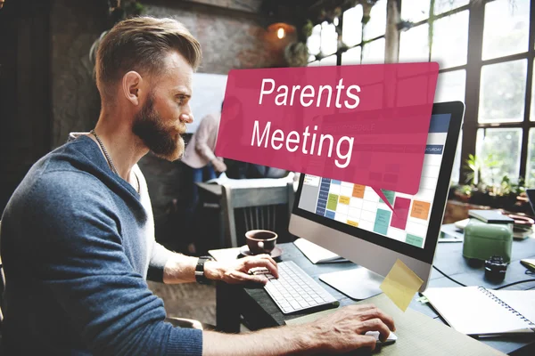 Parents meeting on computer monitor