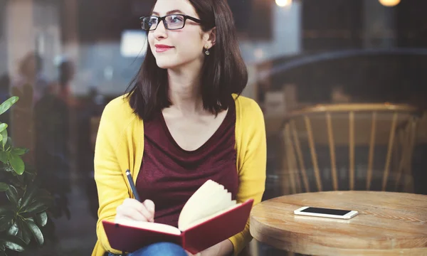 Woman Reading in Cafe