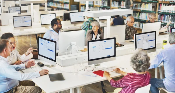 Senior adult students in computer class