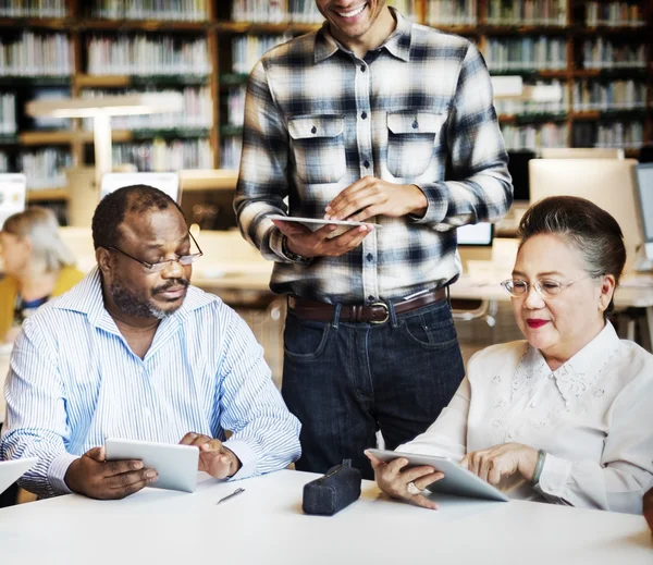 Diversity middle aged people studying