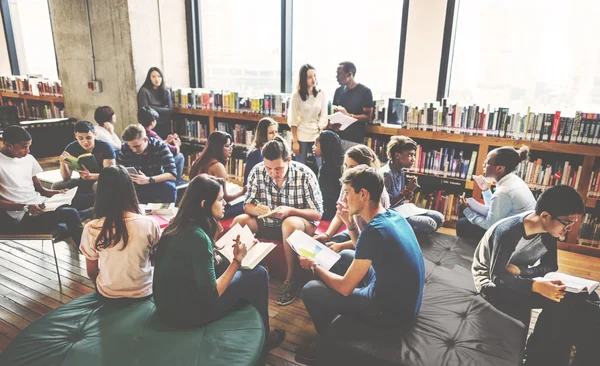 Diversity students studying together in library