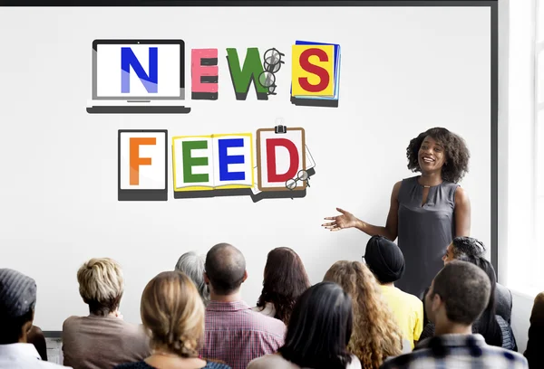 People at seminar with news feed