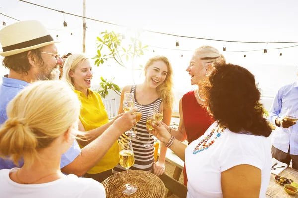 People sitting at table and celebrating