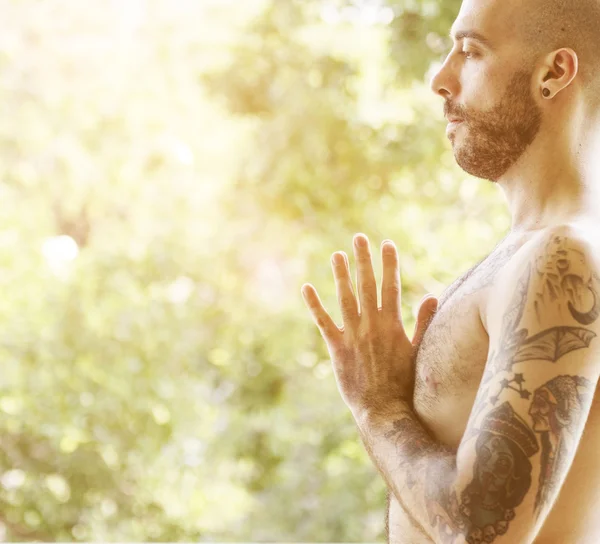 Active man practicing yoga