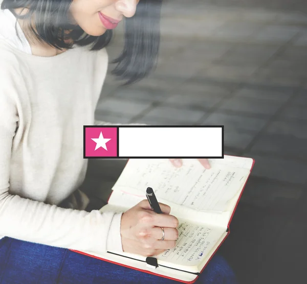 Woman writing in notebook with searching