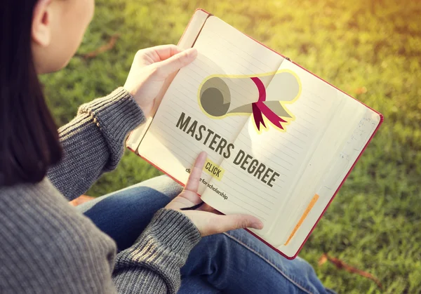 Woman reading book and masters degree