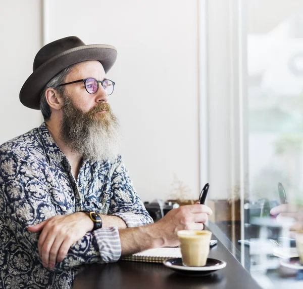 Man with Beard drinking Coffee