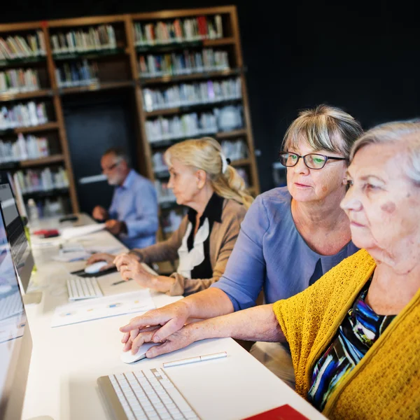 Senior adult students in computer class