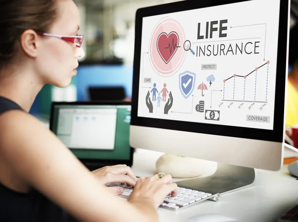 Businesswoman working on computer with life insurance