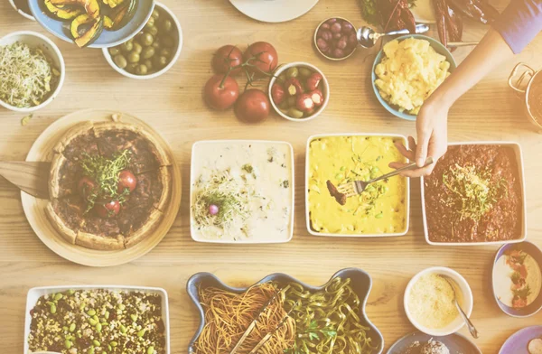 Friends eating for big table