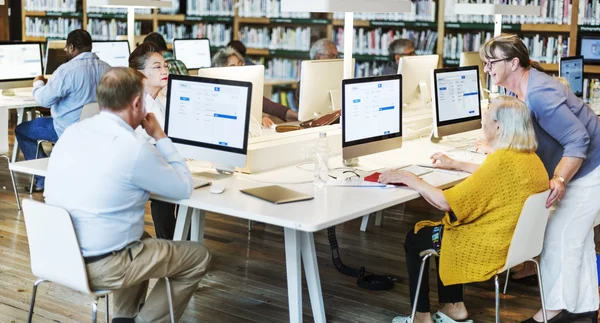 Senior adult students in computer class