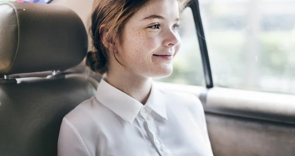 Young lady in car