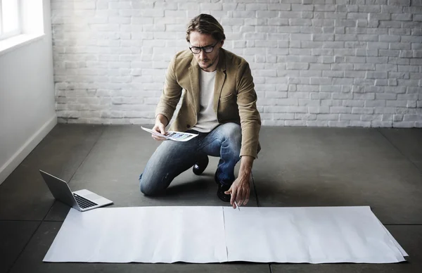 Businessman working with blank poster